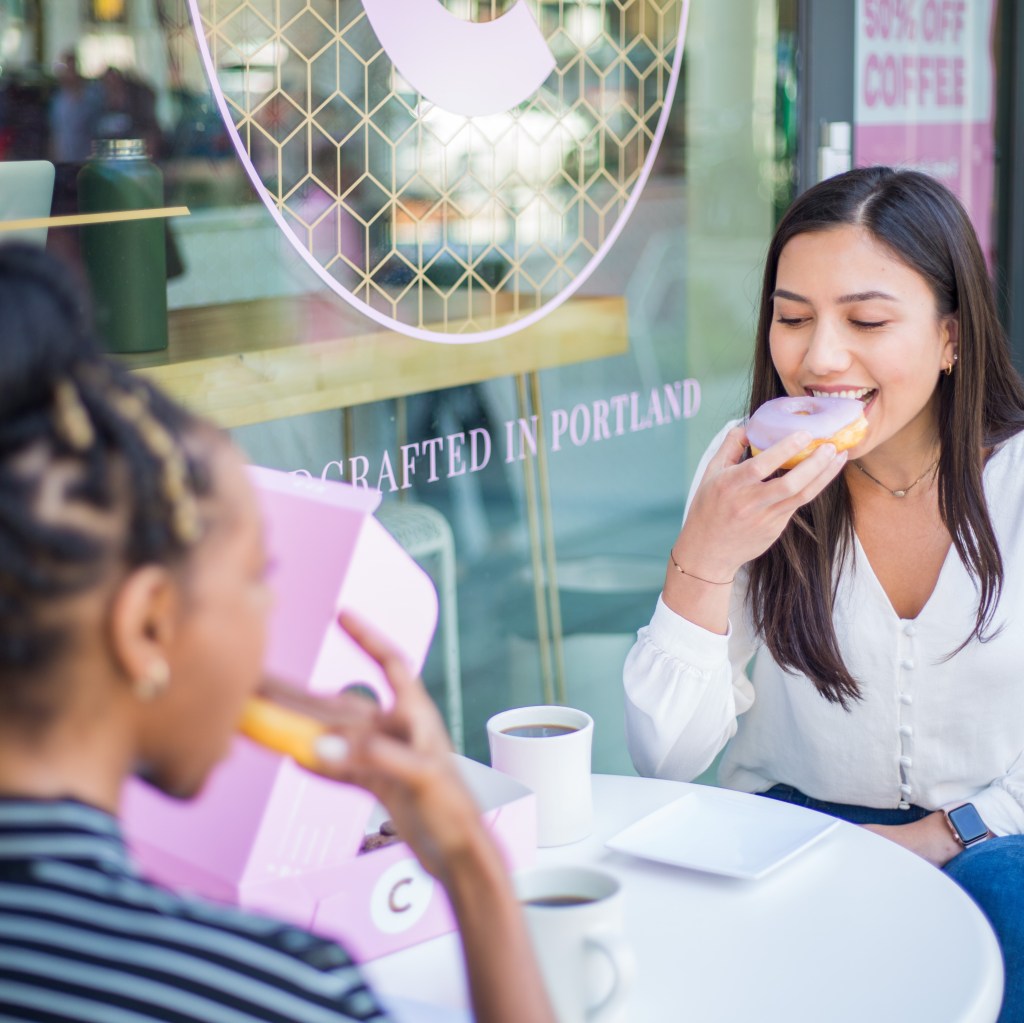 Students enjoying CoCo Donuts at the Karl Miller Center